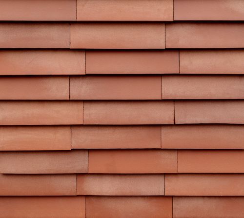 Terracotta zirkuläre Ziegelfassade in Vidra