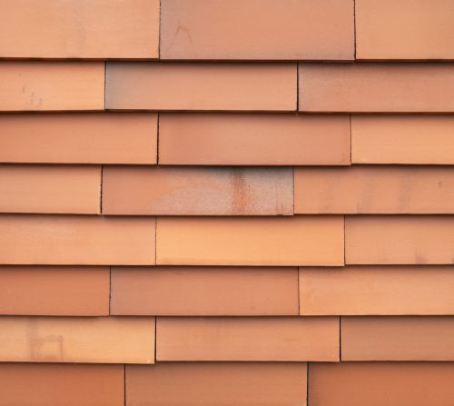 Orangefarbene Vidra Ziegelfassade, zirkulär